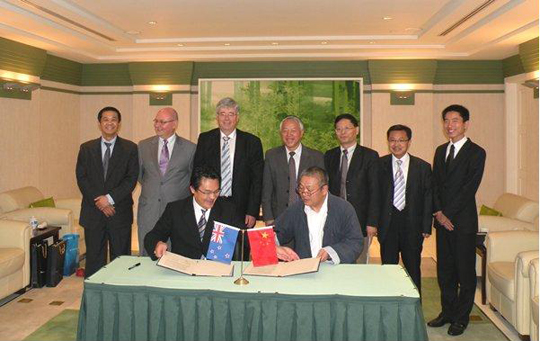 Pat Walsh, Rob Rabel and Xiaoming Huang meet officials at Fudan University