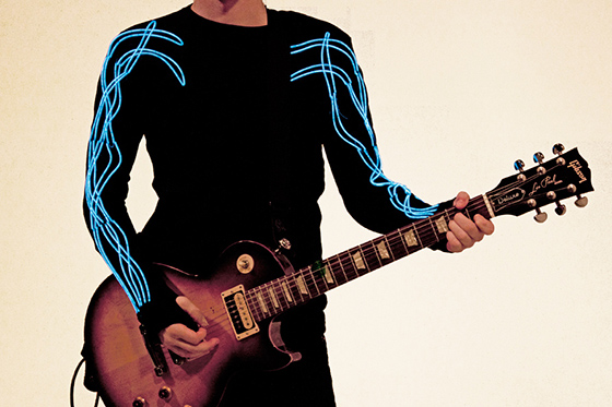 Entry in the Wearable Technology show. A shirt with sleeves that light up when they sense sound.