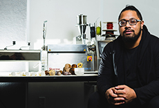 Lionel Taito-Matamua beside his project