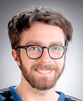 Profile photo of Ethan McKenzie, wearing glasses