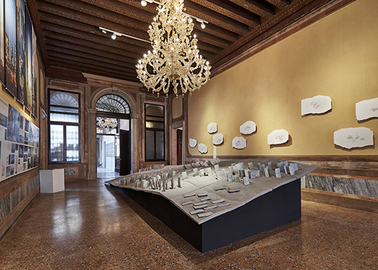 Architecture Lecturer Simon Twose exhibit Concrete/ cloud/ is a large piece of concrete with smaller pieces of concrete sitting on top of it.