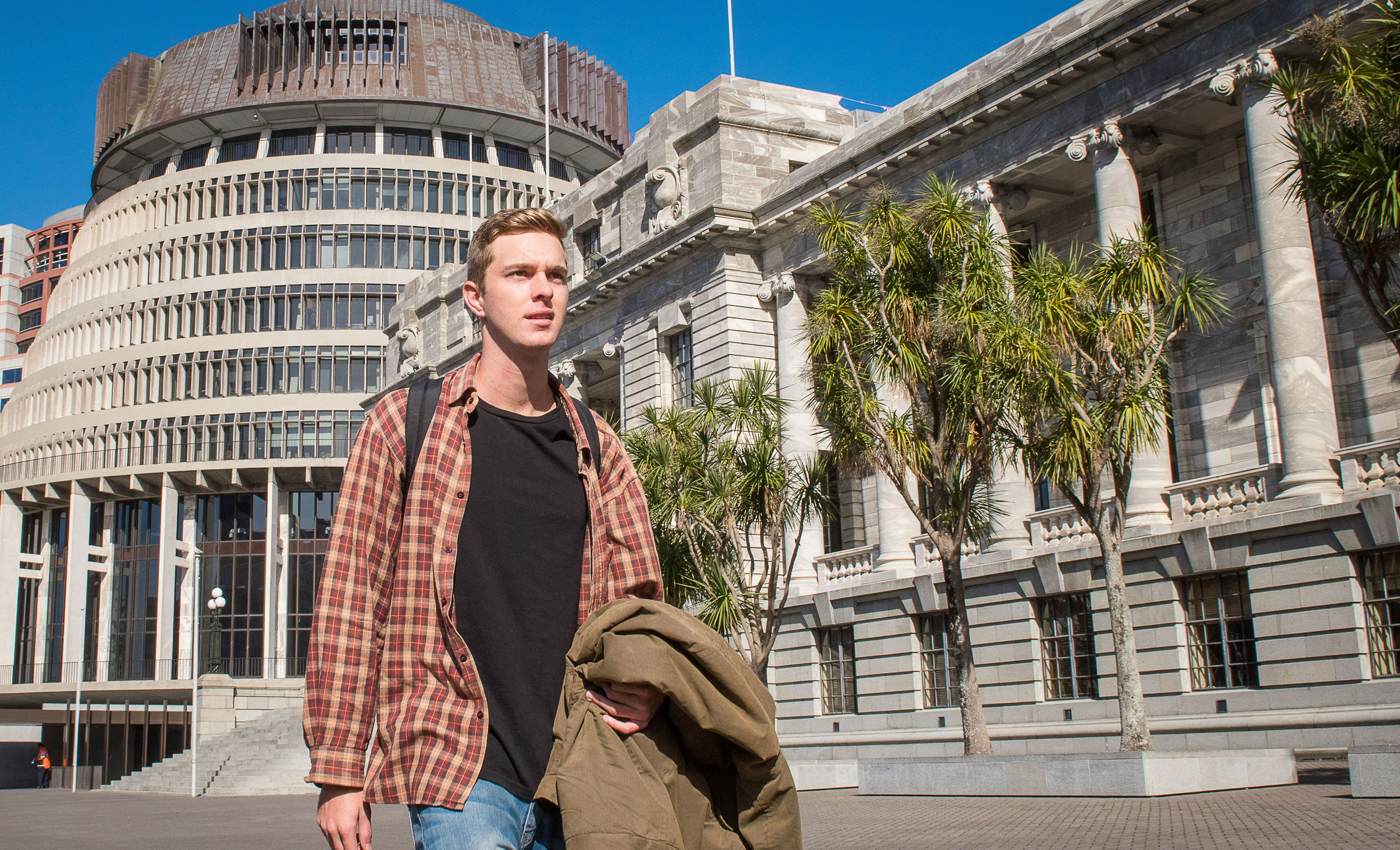 Scott walks purposefully past the Beehive.
