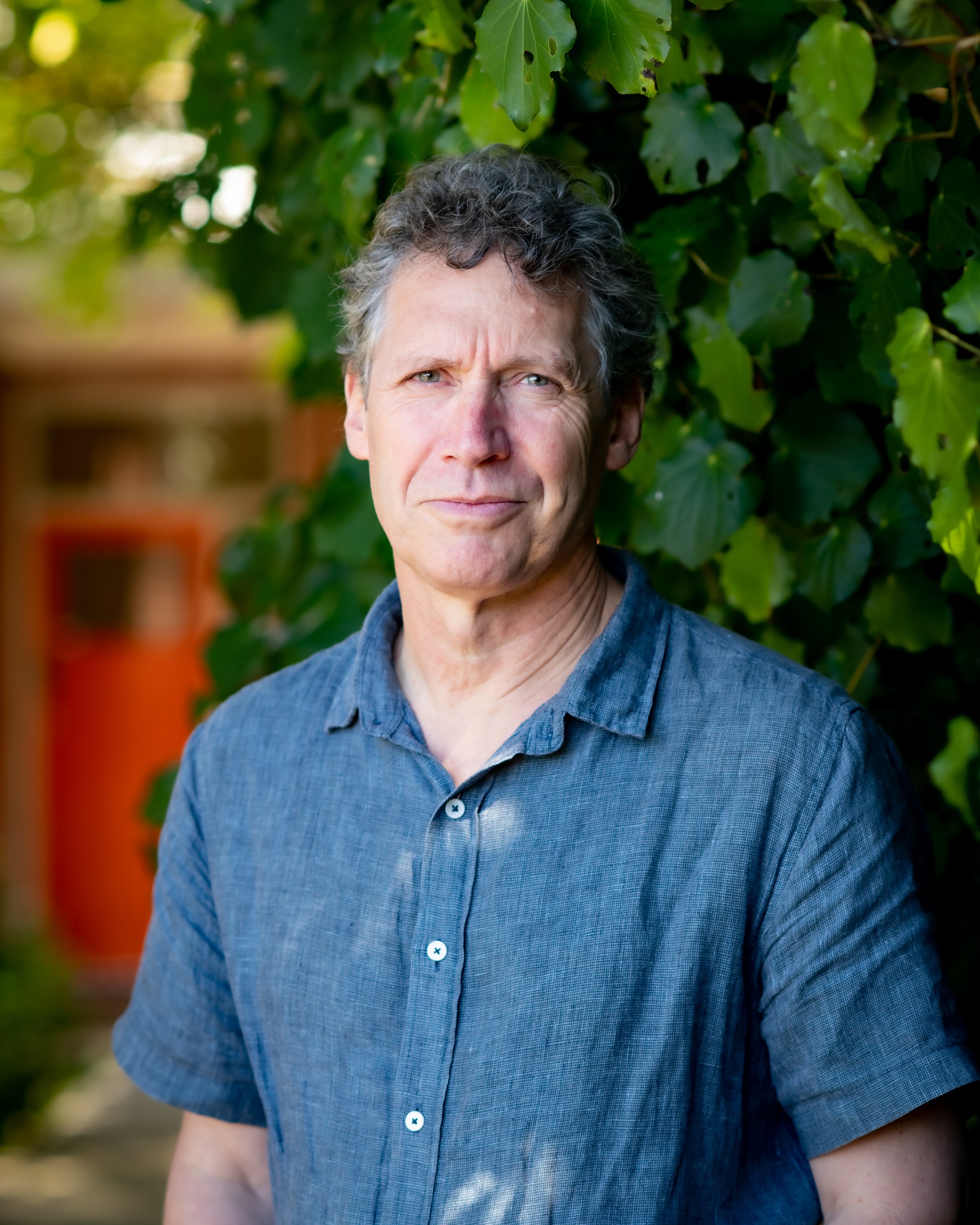 Nick Bollinger in front of plants portrait