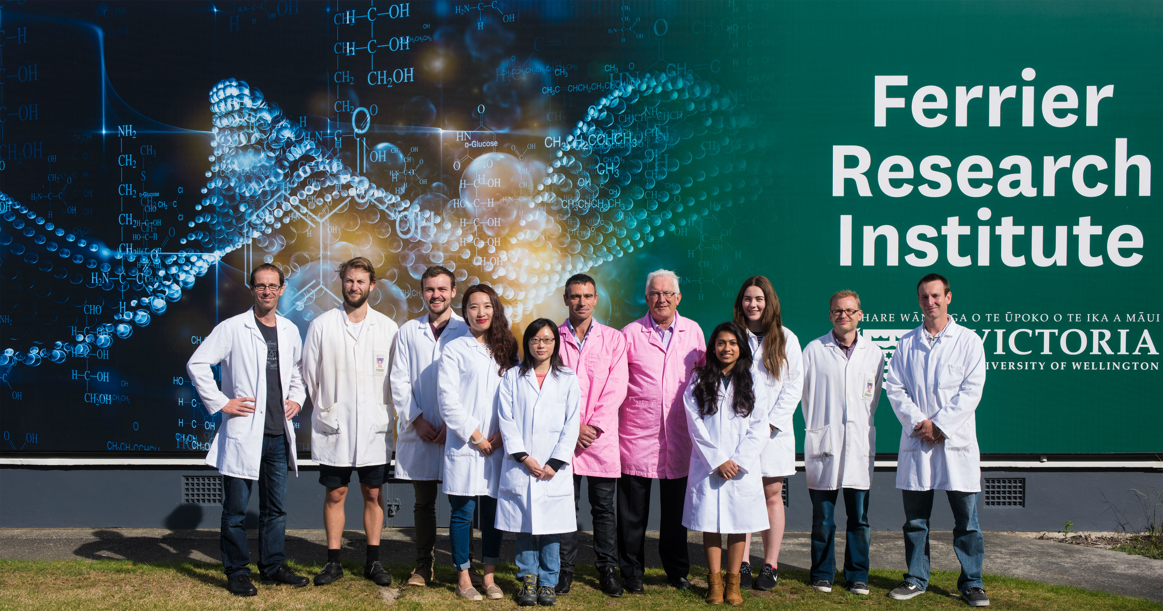 The Ferrier breast cancer immunology team infront of the Ferrier banner