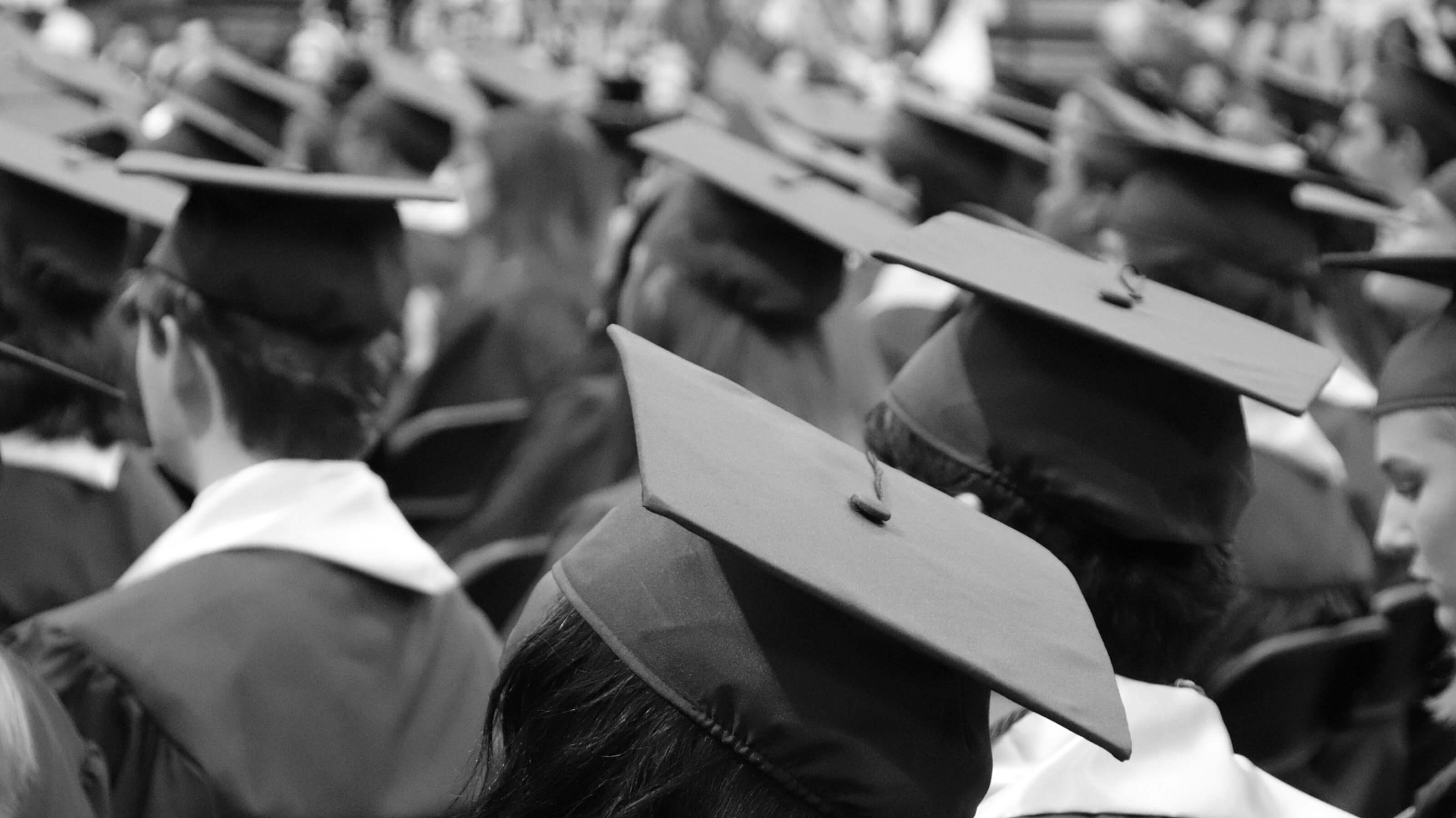 postgraduate-support.jpg Black and white image of students graduating.