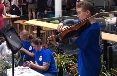 Te Kōkī New Zealand School of Music student Georgia Steel plays the viola at a Victoria celebration for Mental Health Awareness Week.