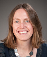 Portrait of Nikki smiling into the camera.