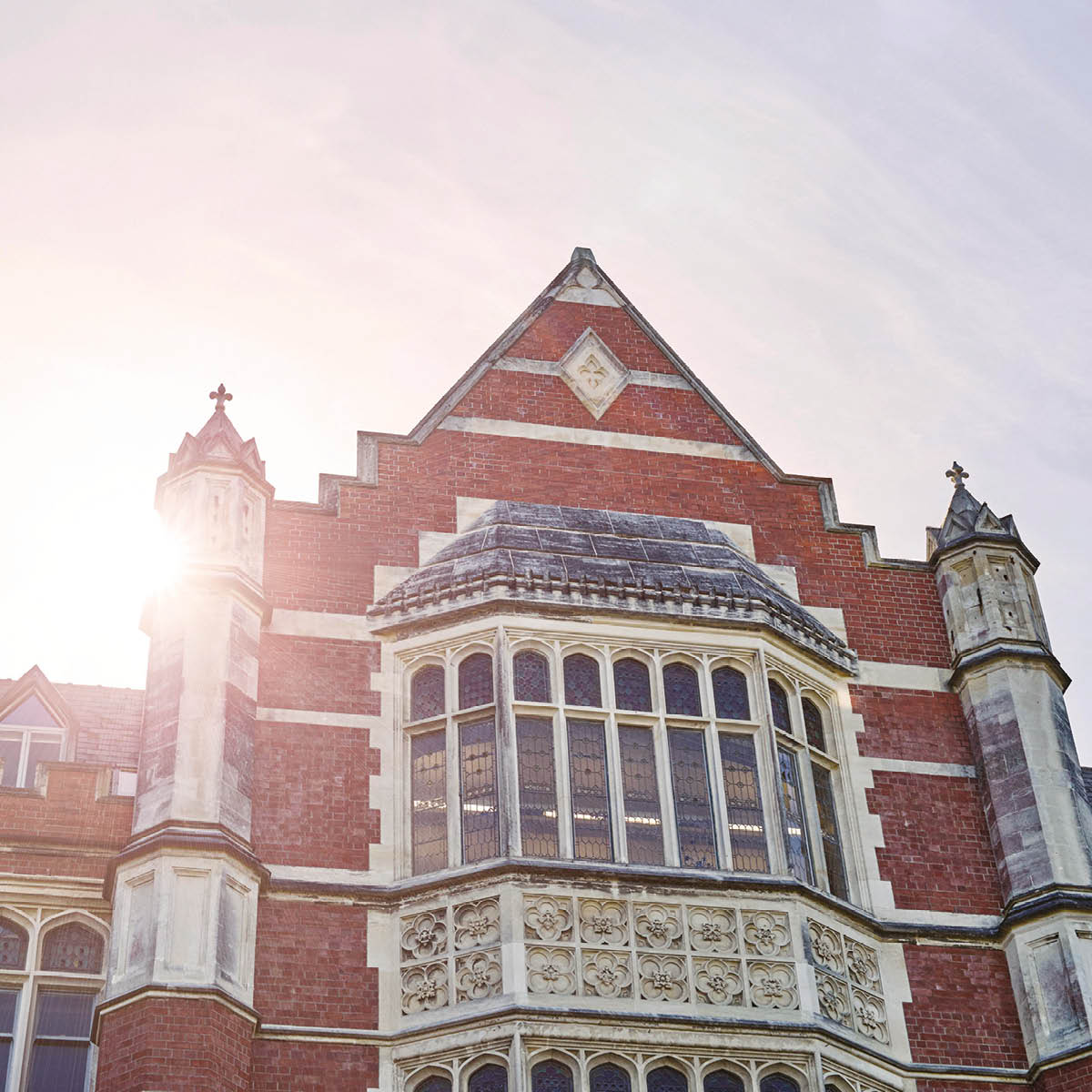 The front of the Hunter building at Te Herenga Waka—Victoria University of Wellington, with the sun setting behind.