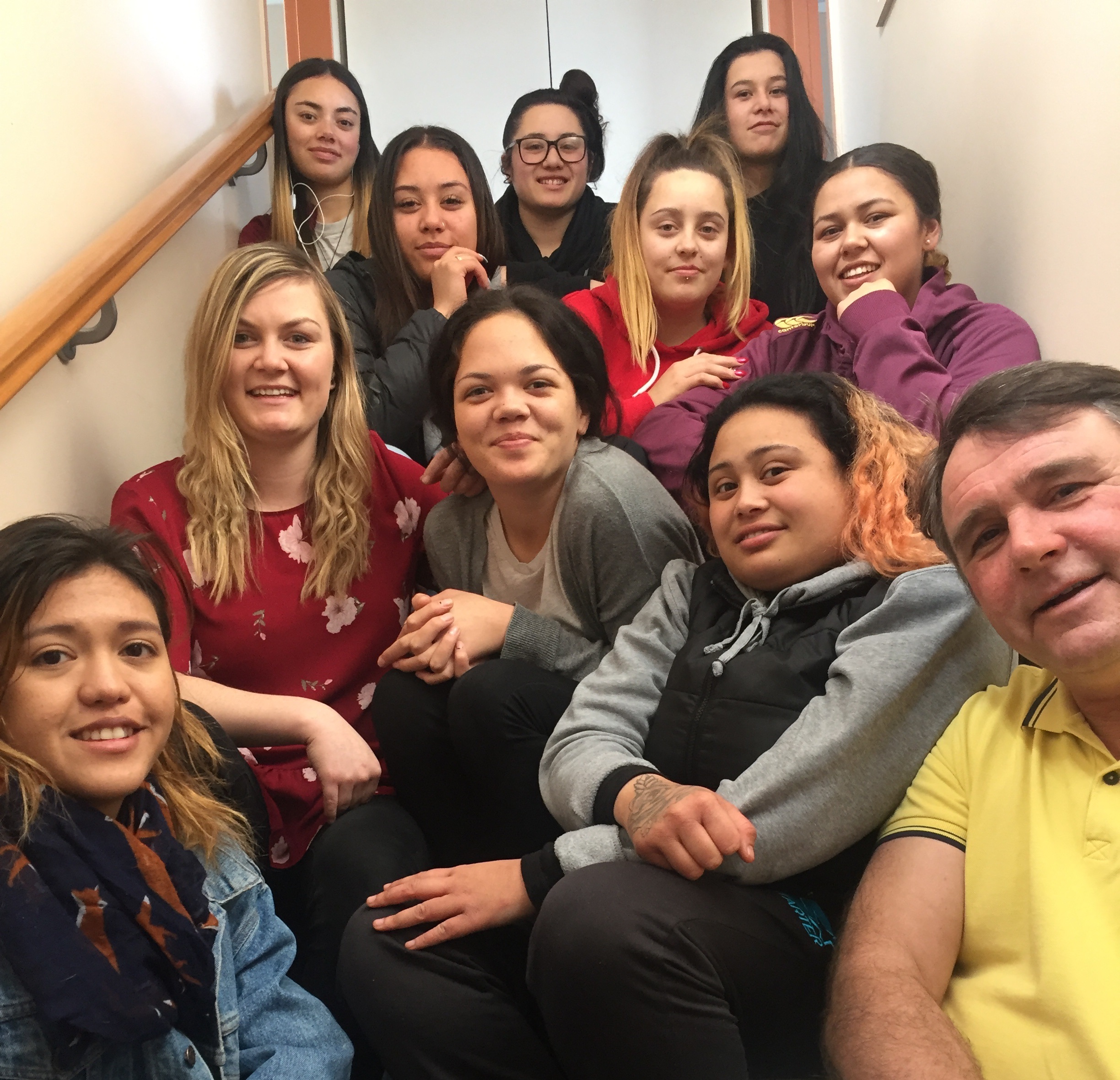 Young Maori mothers sit with filmmakers.