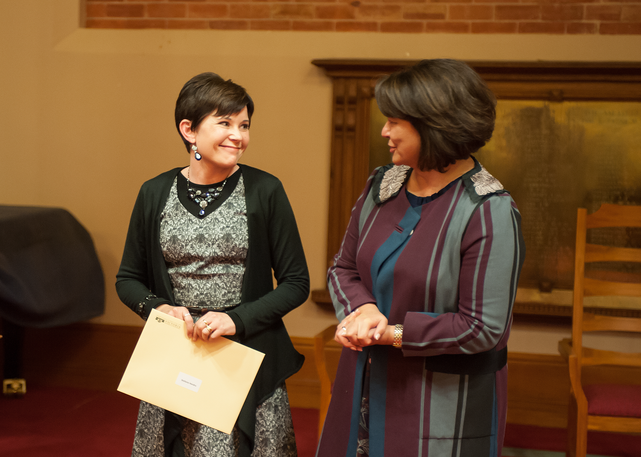 Stefanie Hendra receives her award from the Hon Hekia Parata