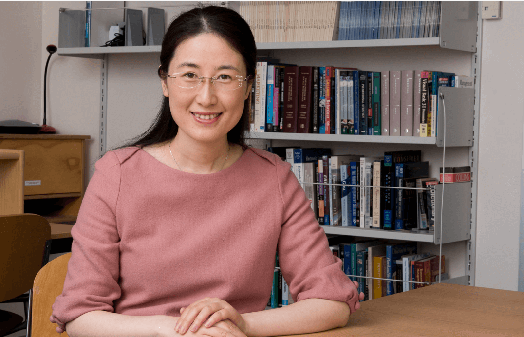 An image of PhD graduate, Dr Honghong Zhang in an office.