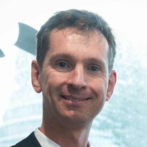Headshot of man in suit