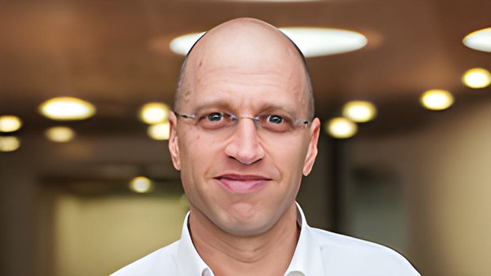 An image of Ilan Noy against a light background.