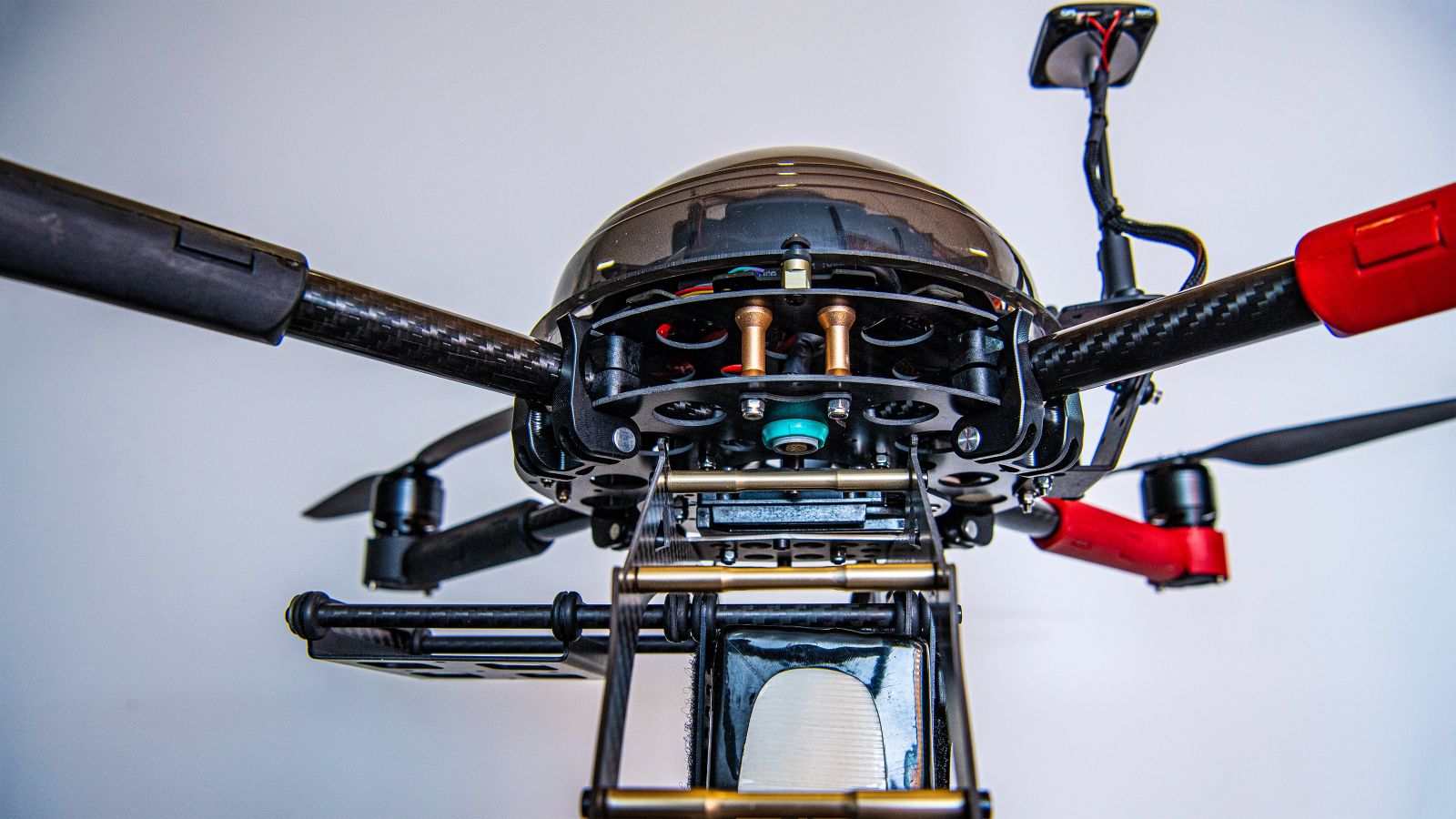 UAV drone Close up of round mechanical device that has extending arms with propellors