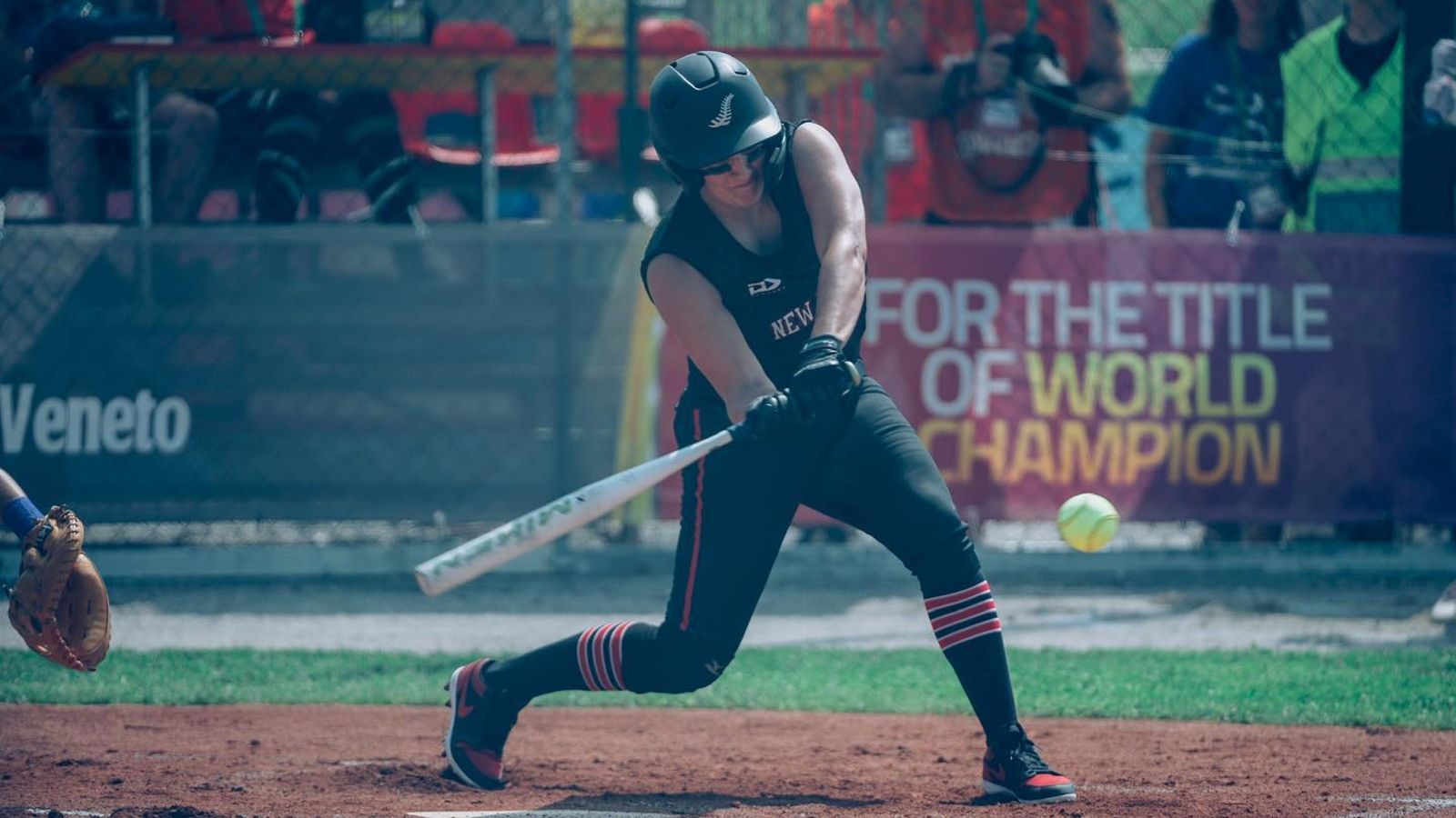 Lara Andrews going to hit the ball during a softball game
