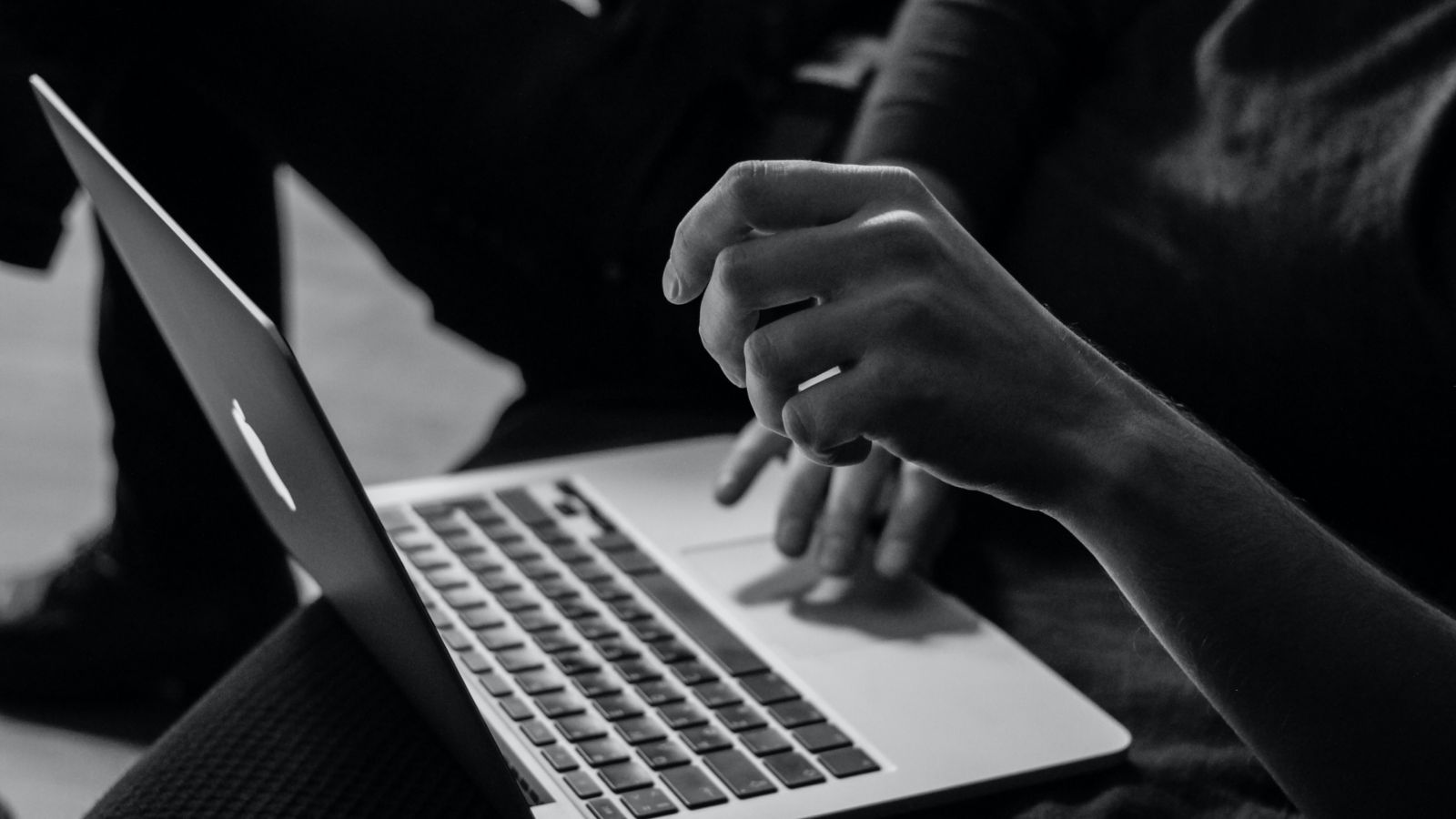 A person typing on a laptop