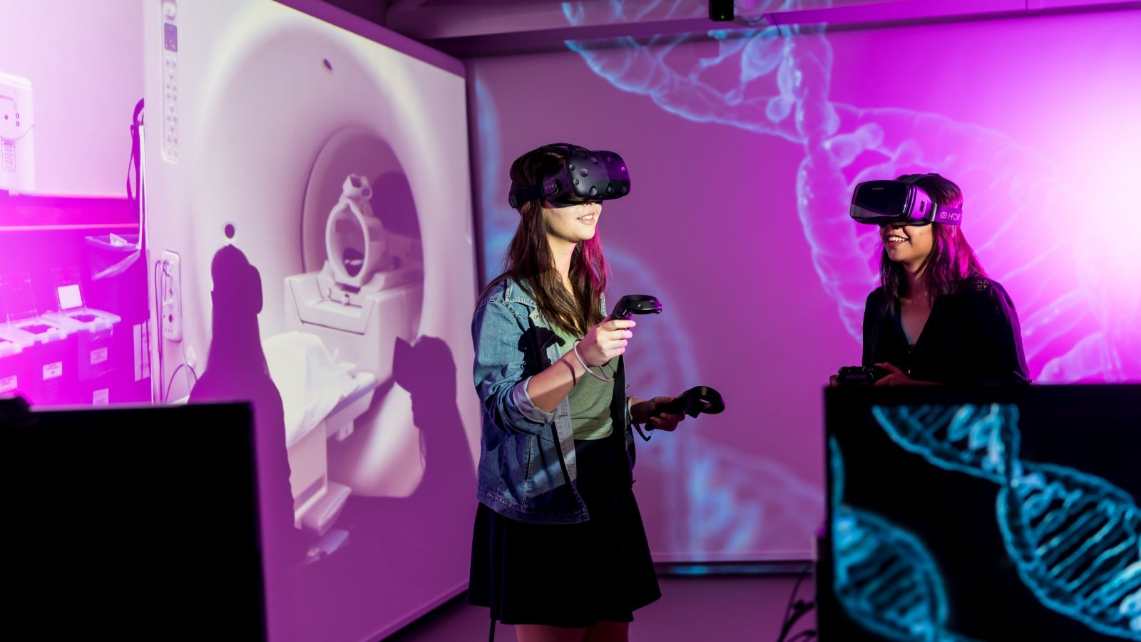 Two women use VR equipment