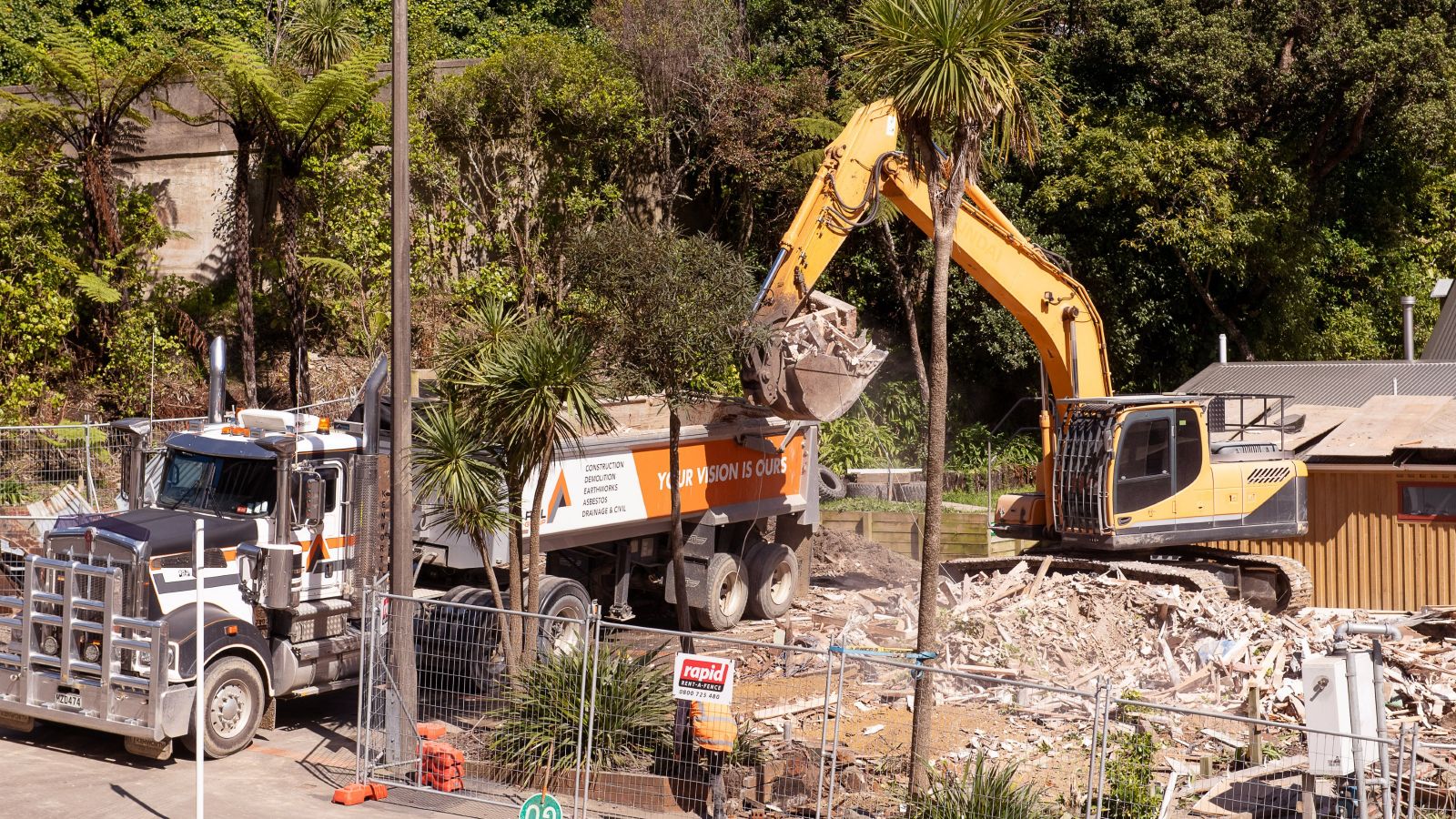 Digger and truck at Ngā Mokopuna site