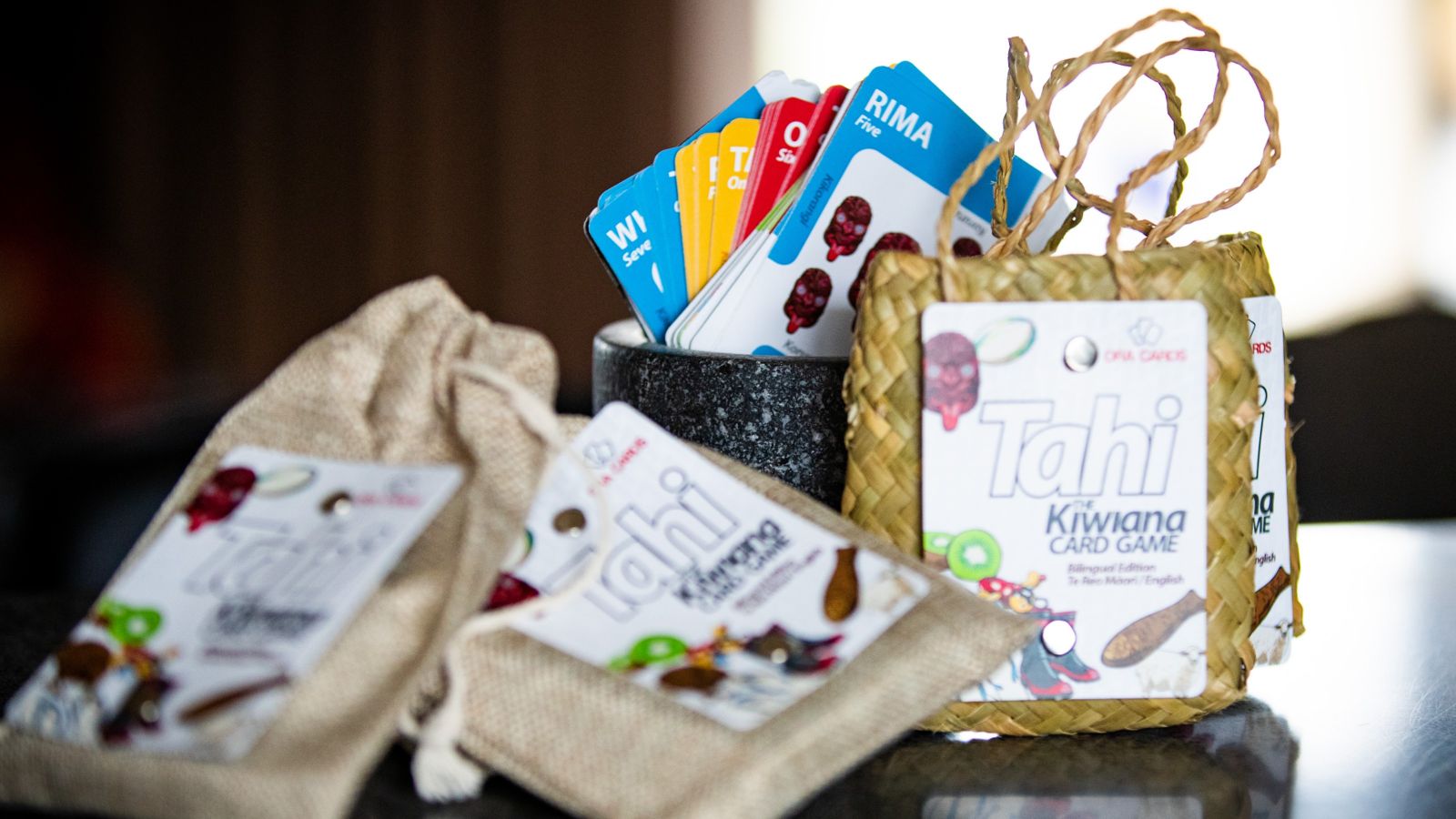 Ora-card.JPG three woven bags with card game inside