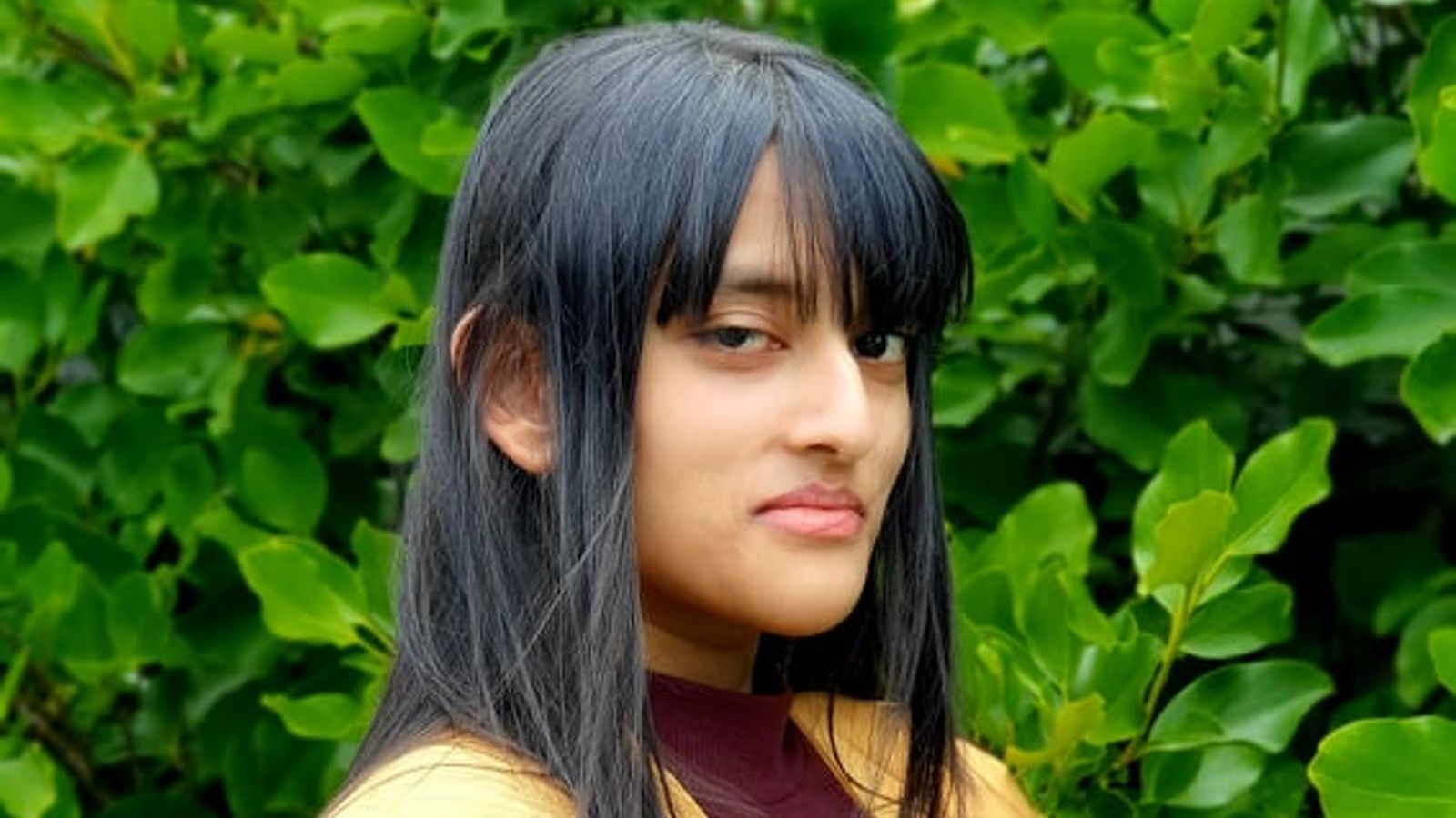 shuari-naidoo.jpg women standing sideways facing the camera