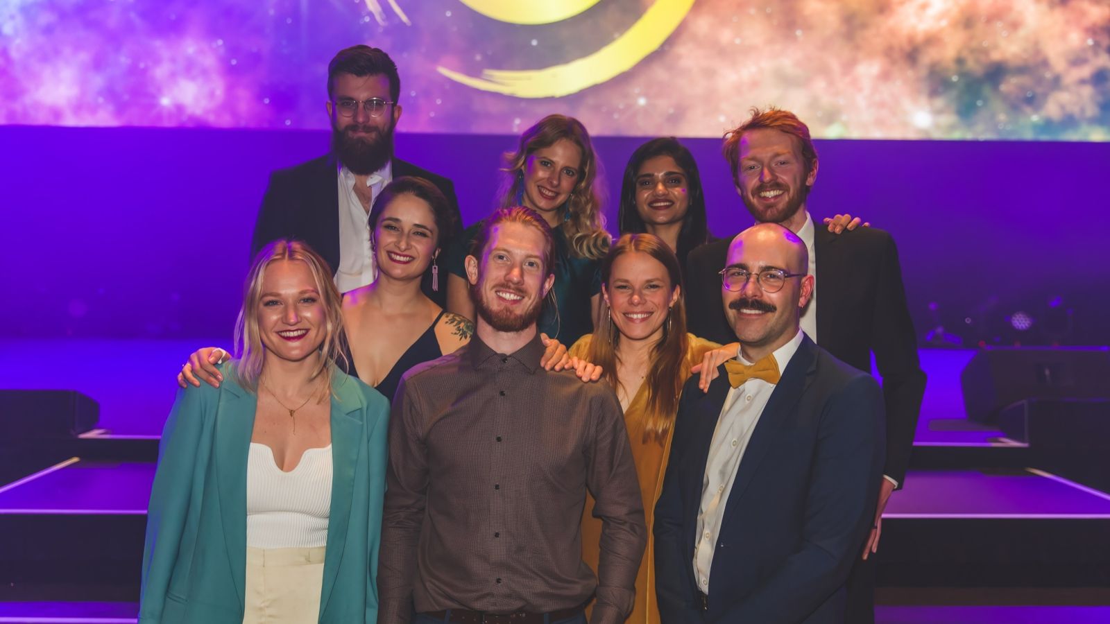 obvious-brand-partners.jpg group of adults dressed up with glamourous background