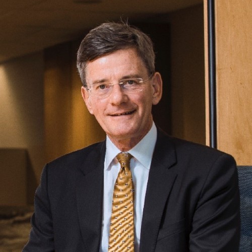Male staring directly into camera in business attire