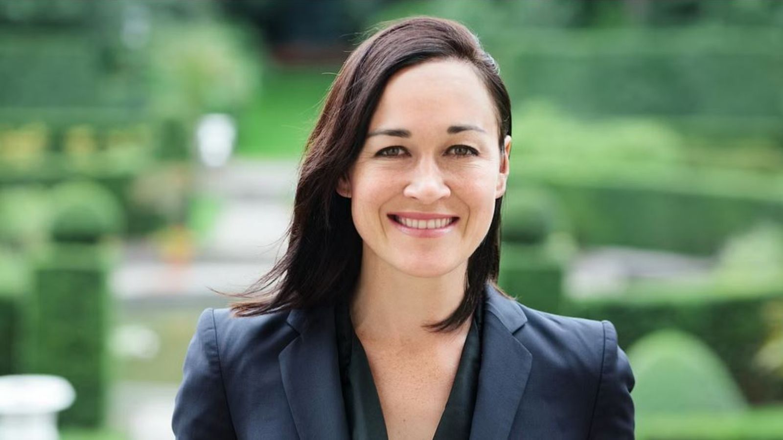 Sarah Grimmer of Twenty Essex Chambers wears a black jacket and smiles