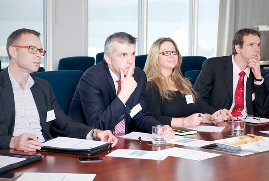 Shadow a CFO judges watch a student presentation. 