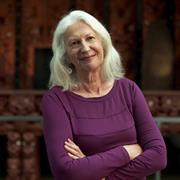 Older woman smiling into camera in professional photo