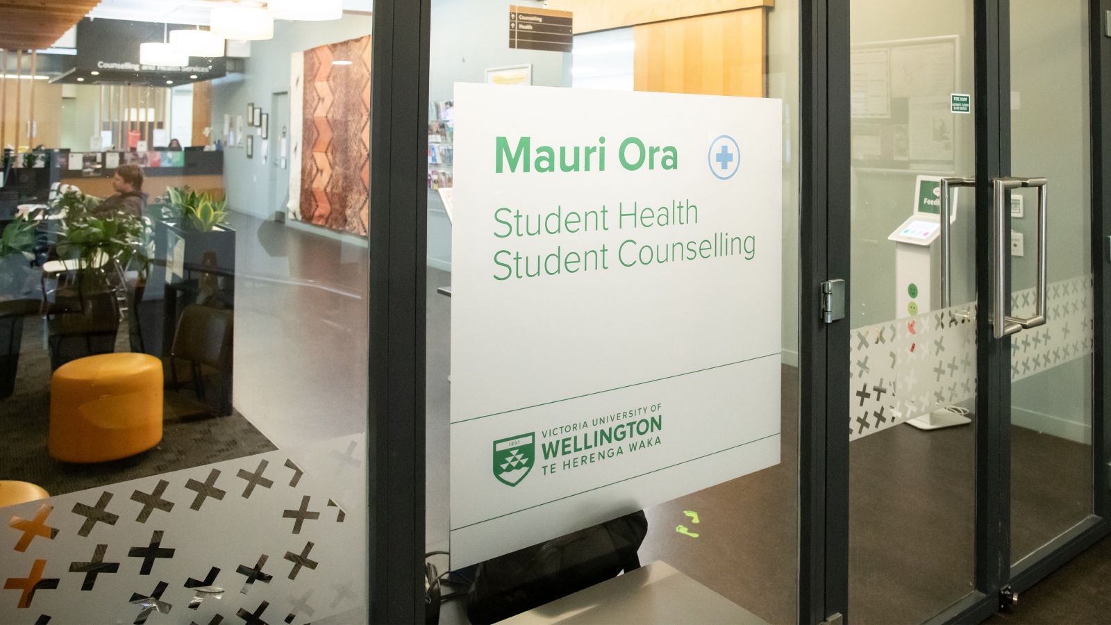 Doors outside Mauri Ora with the words 'Mauri Ora Student Health and Counselling' on them