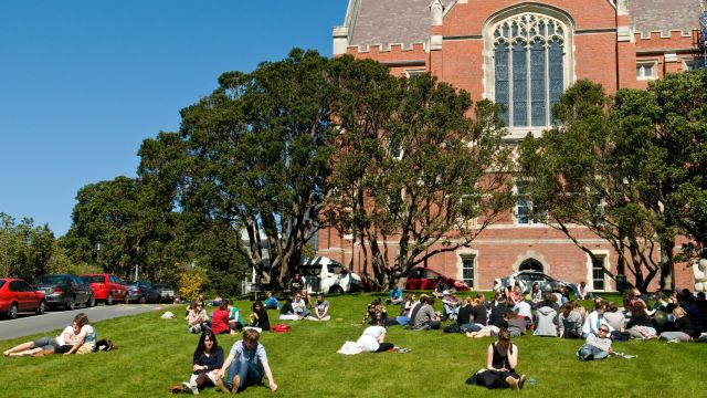 A photo of the Hunter Lawn at the Kelburn Campus with students seated